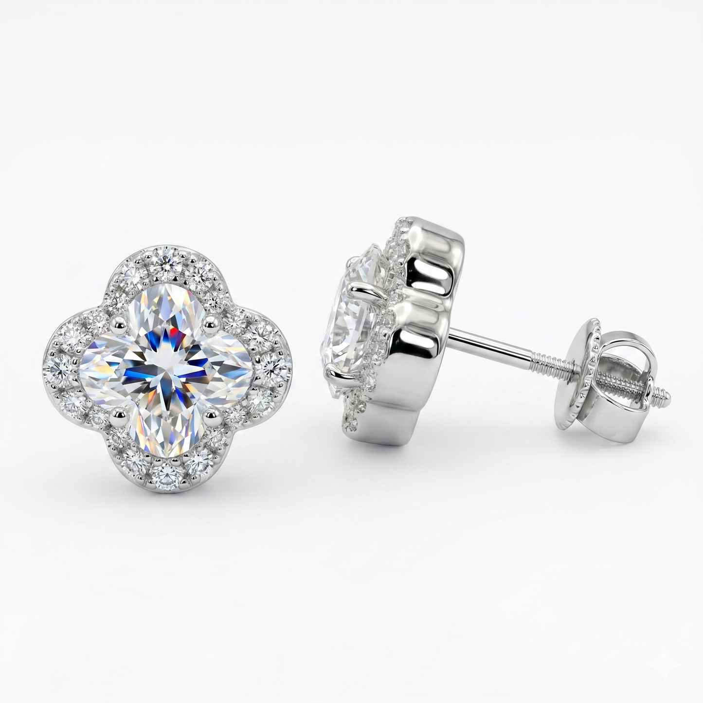 Pair of silver earrings with clear gemstones on a white background