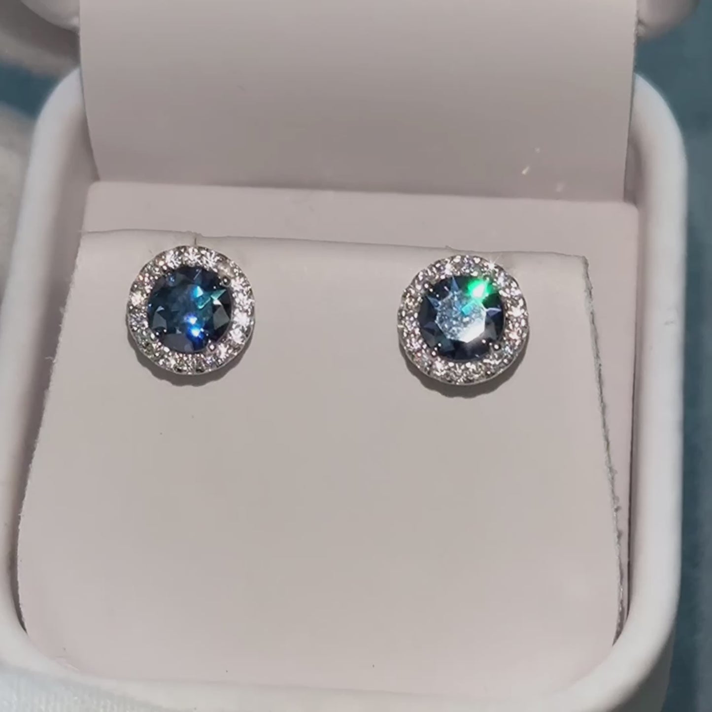 Load and play video in Gallery viewer, Feliz 2.00 CTW Blue Moissanite Halo Stud Earrings
