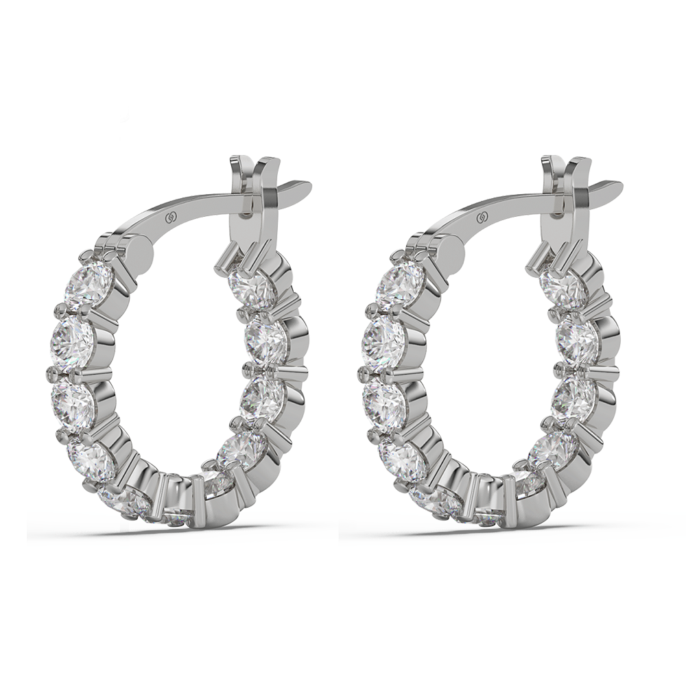 A pair of hoop earrings with multiple stones, possibly Moissanite, set in a basket style mounting.